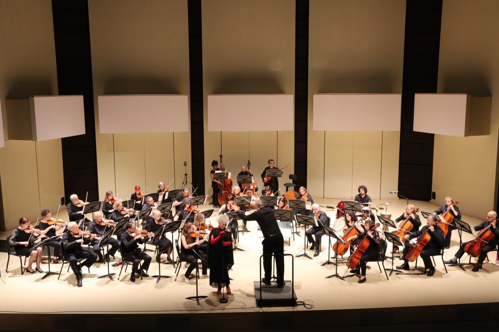 The full orchestra on stage at the Tribute Communities Recital Hall, York University