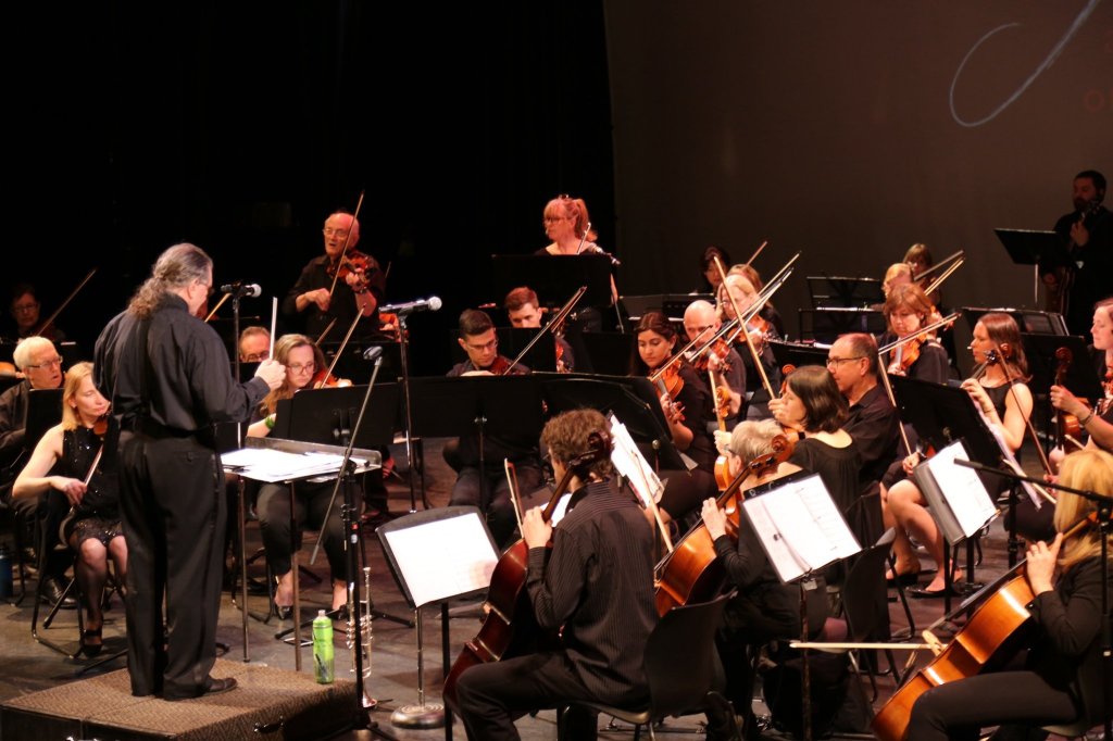 The orchestra in performance at the 2019 Season Finale, seen from the side
