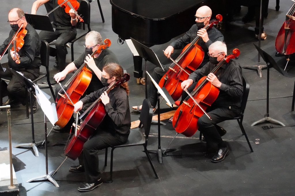 Cellists and bassists rehearsing on stage before the 2022 Season Finale