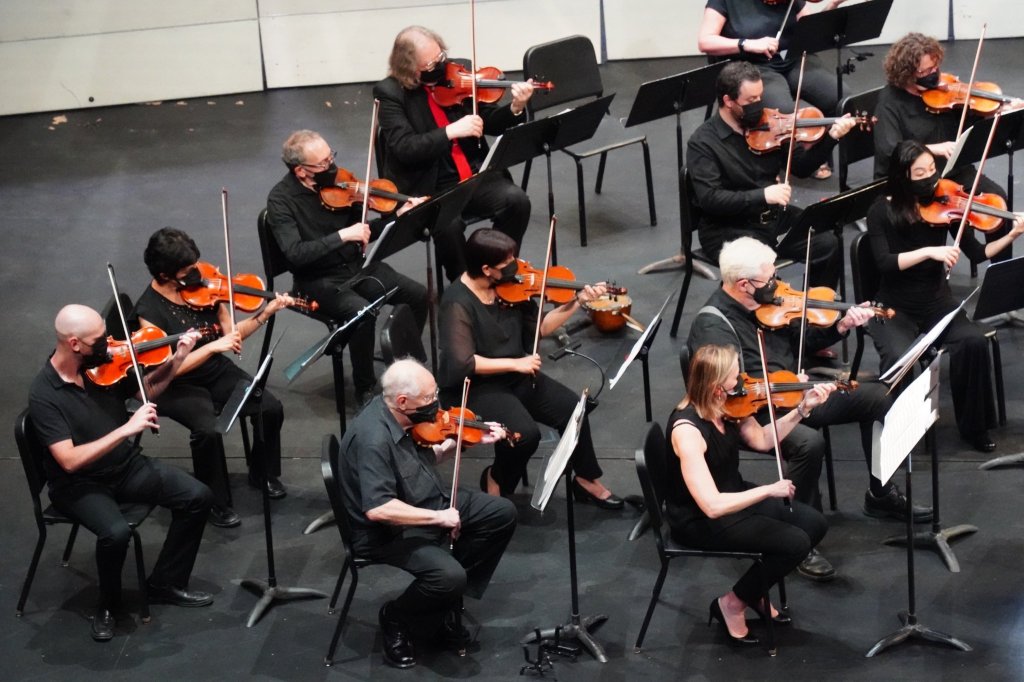 String players rehearsing on the MacMillan Theatre stage
