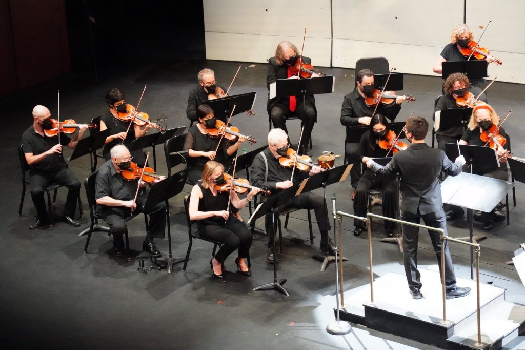 The orchestra and conductor during the final rehearsal on the MacMillan Theatre stage