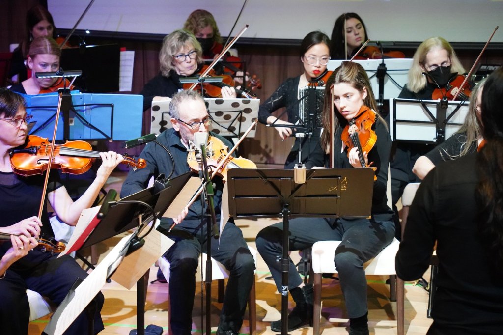 Violinists playing at the 2022 Holiday Concert