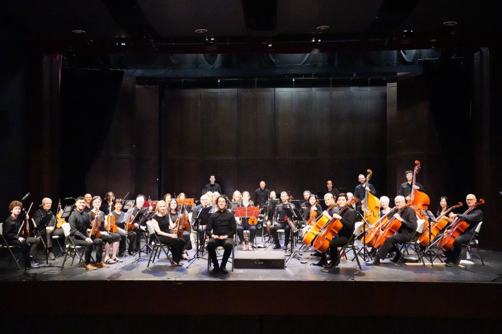 Wide view of the orchestra on stage at the 2023 Season Finale