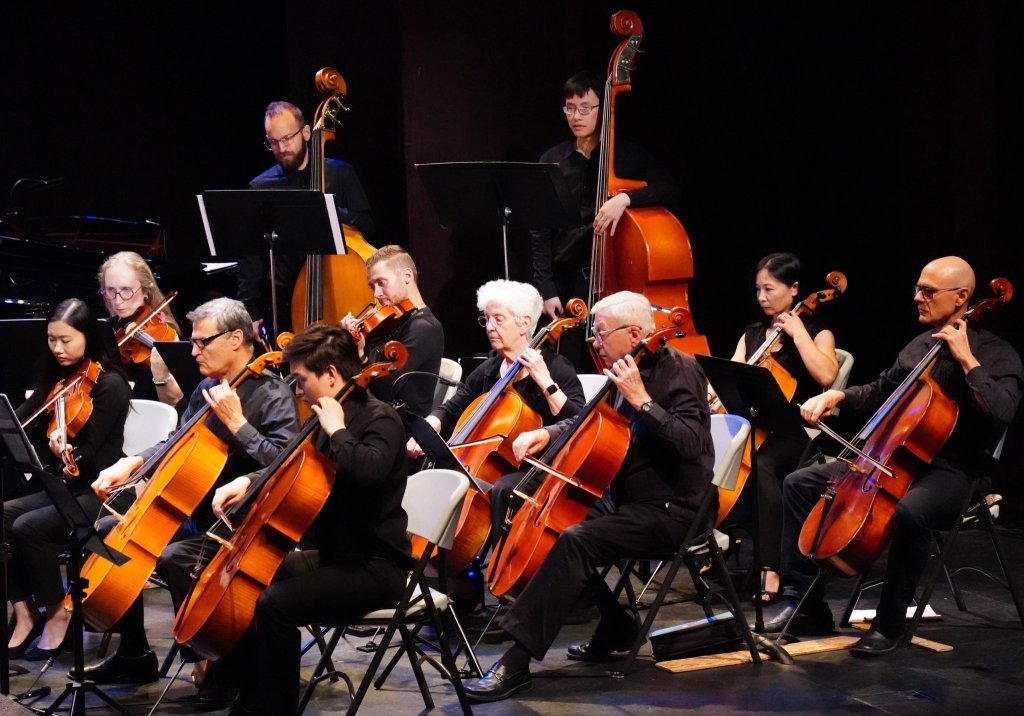 Cellists and bassists playing at the Al Green Theatre