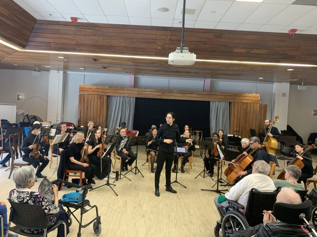 The orchestra playing for residents at Castleview Wychwood Towers