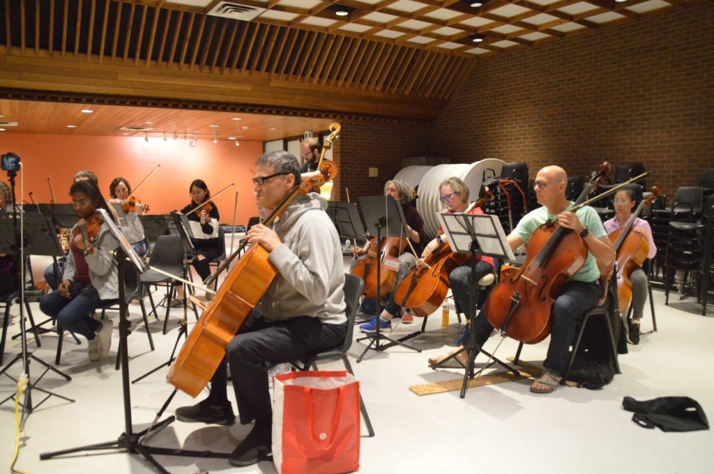 The cello section rehearsing