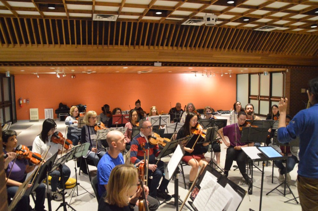 Violinists rehearsing in the hall