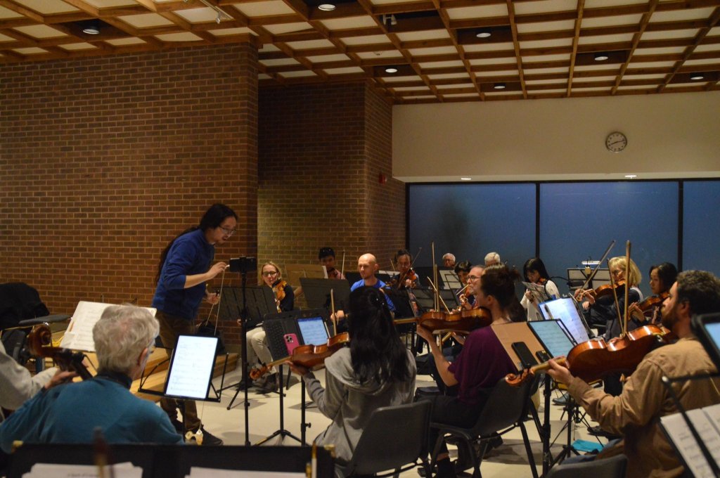 The orchestra rehearsing in the evening