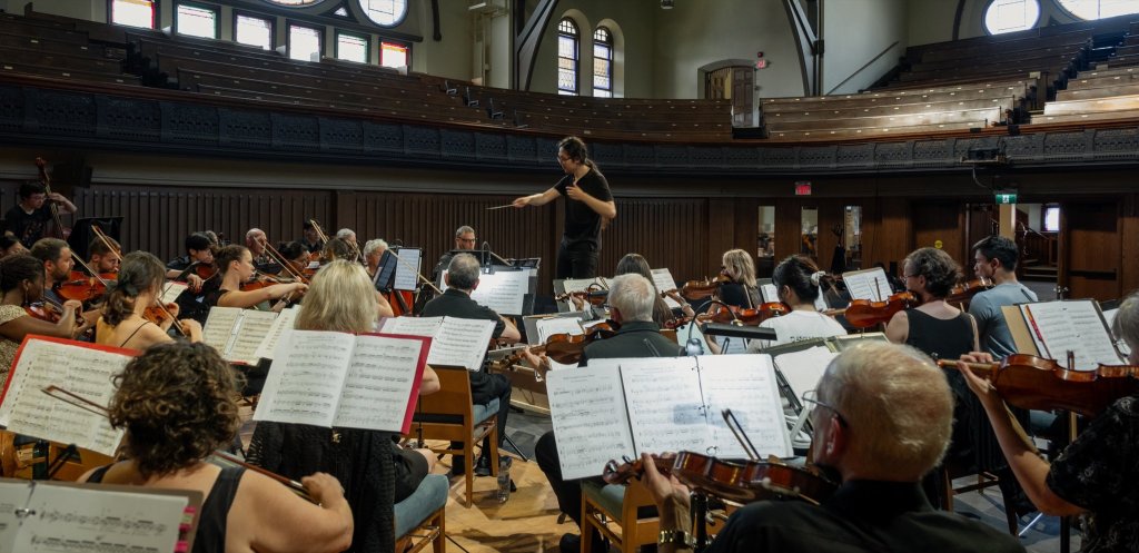 The orchestra seen from the balcony at the 2024 Season Finale