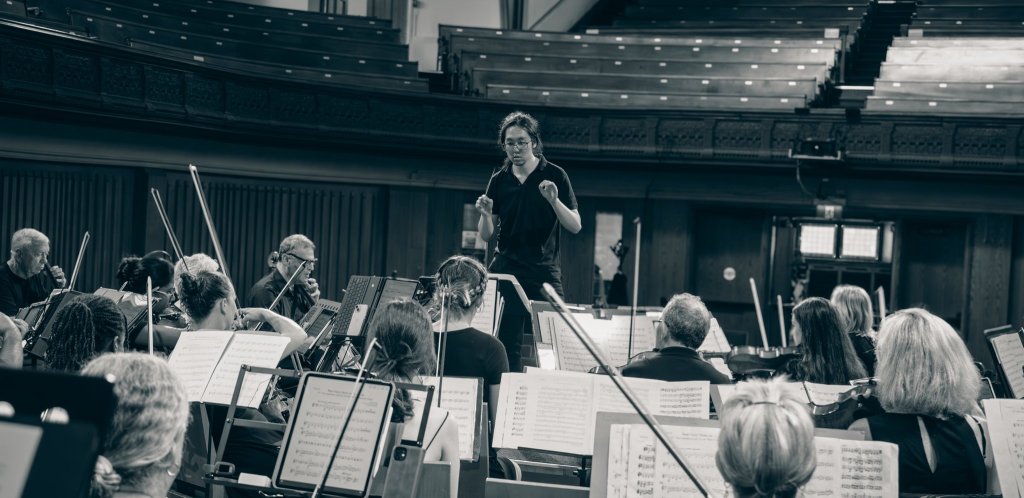 Black-and-white photo of the orchestra performing