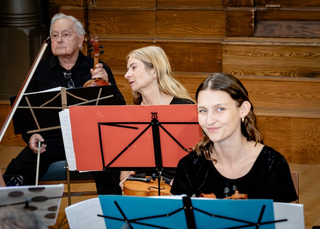 Violinists playing from their music stands