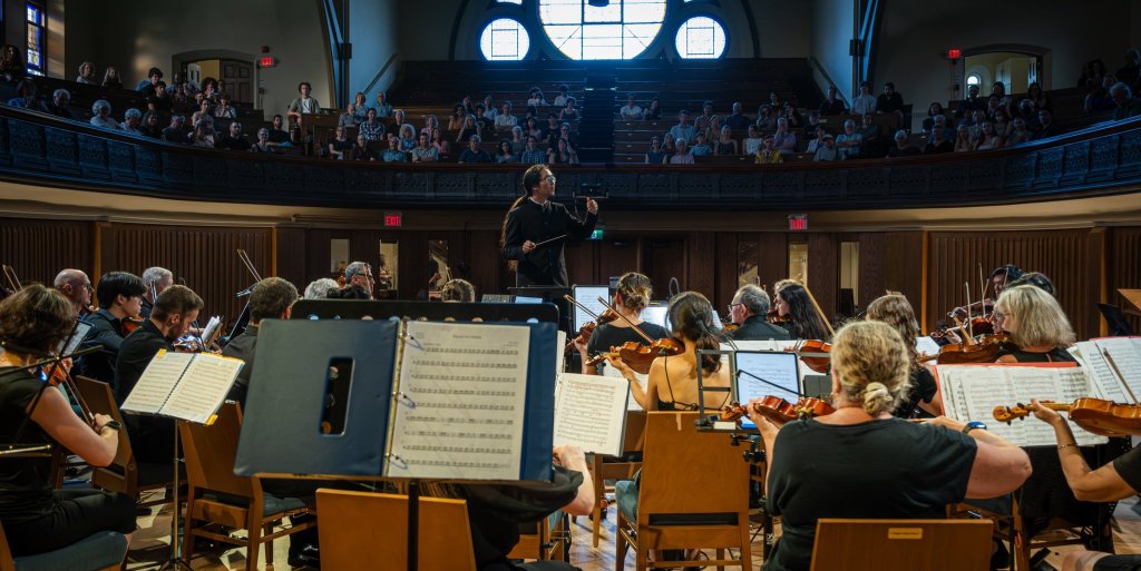 The orchestra and audience at Trinity-St. Paul’s Centre