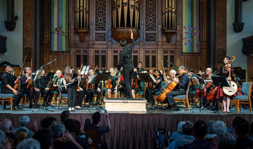 Wide view of the orchestra on stage at Trinity-St. Paul’s Centre