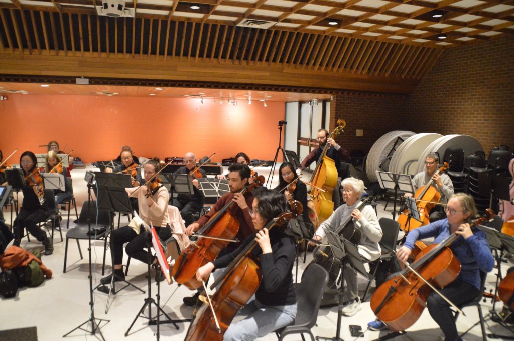 The cello section rehearsing