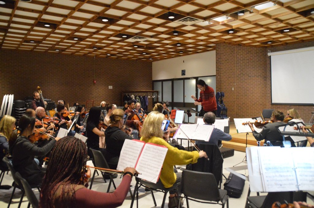 Musicians rehearsing under the coffered ceiling