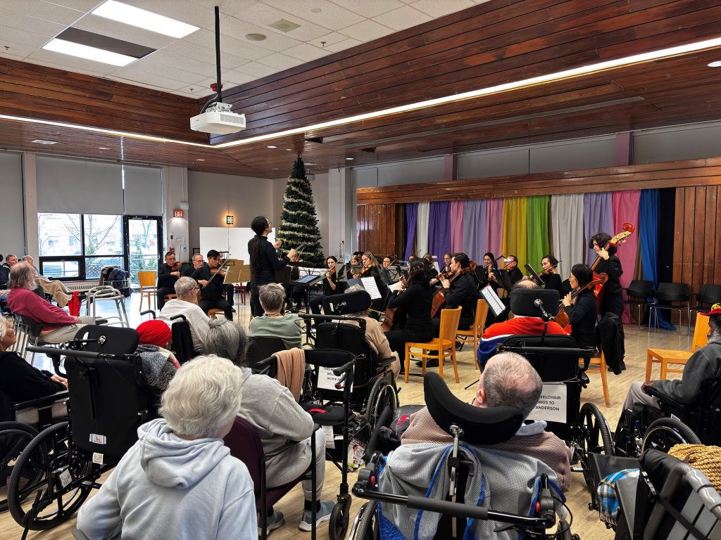 Residents listening to the orchestra at Castleview Wychwood Towers