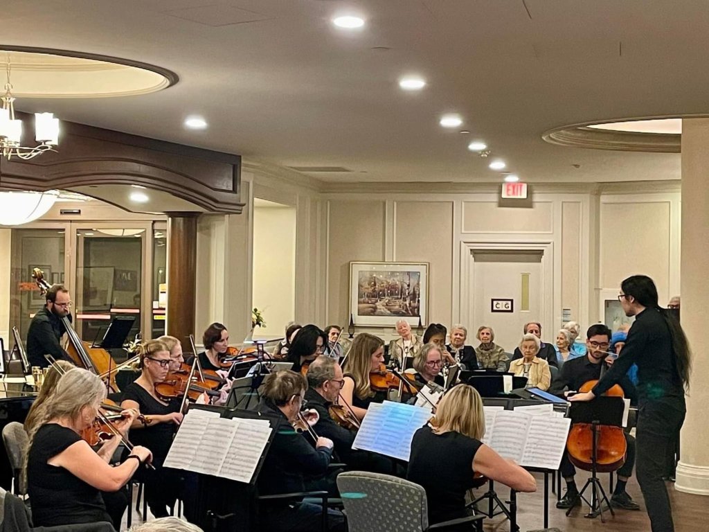 The orchestra performing for residents at Delmanor Northtown