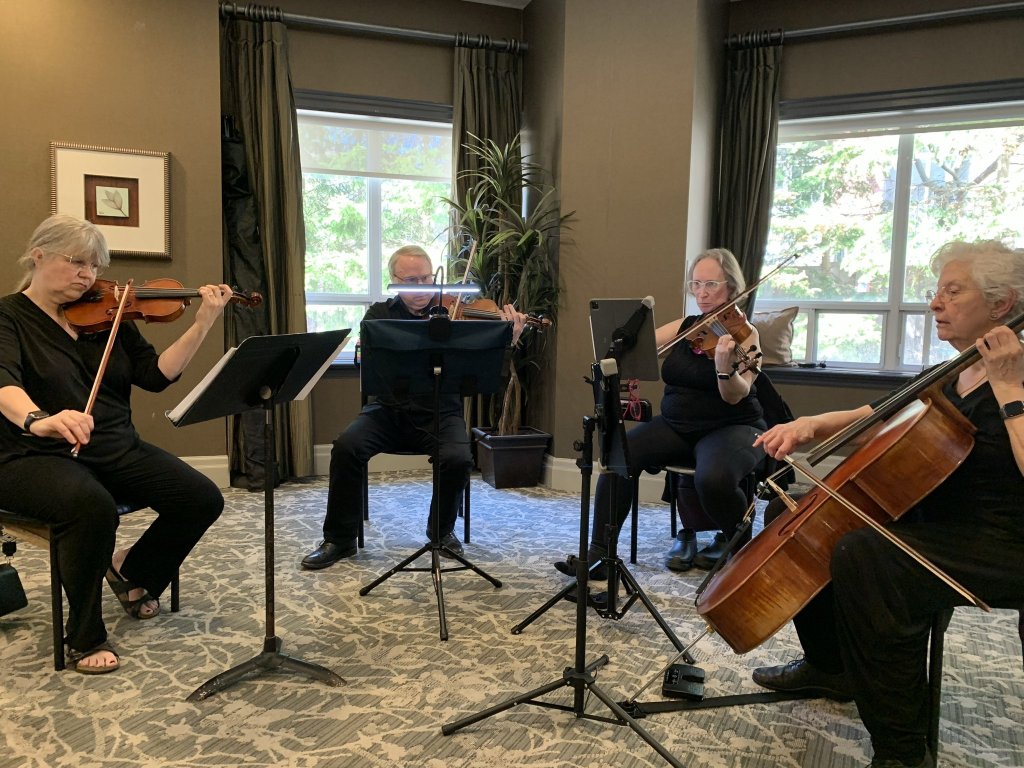 The string quartet playing for residents at Amica Thornhill