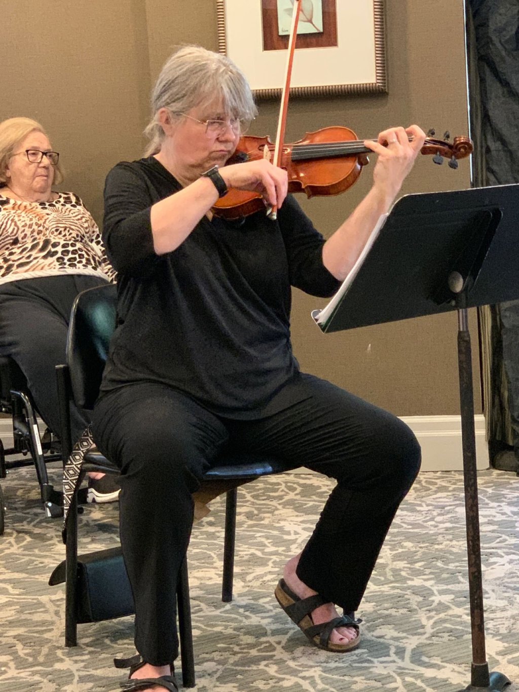 A violinist from the quartet performing at Amica Thornhill