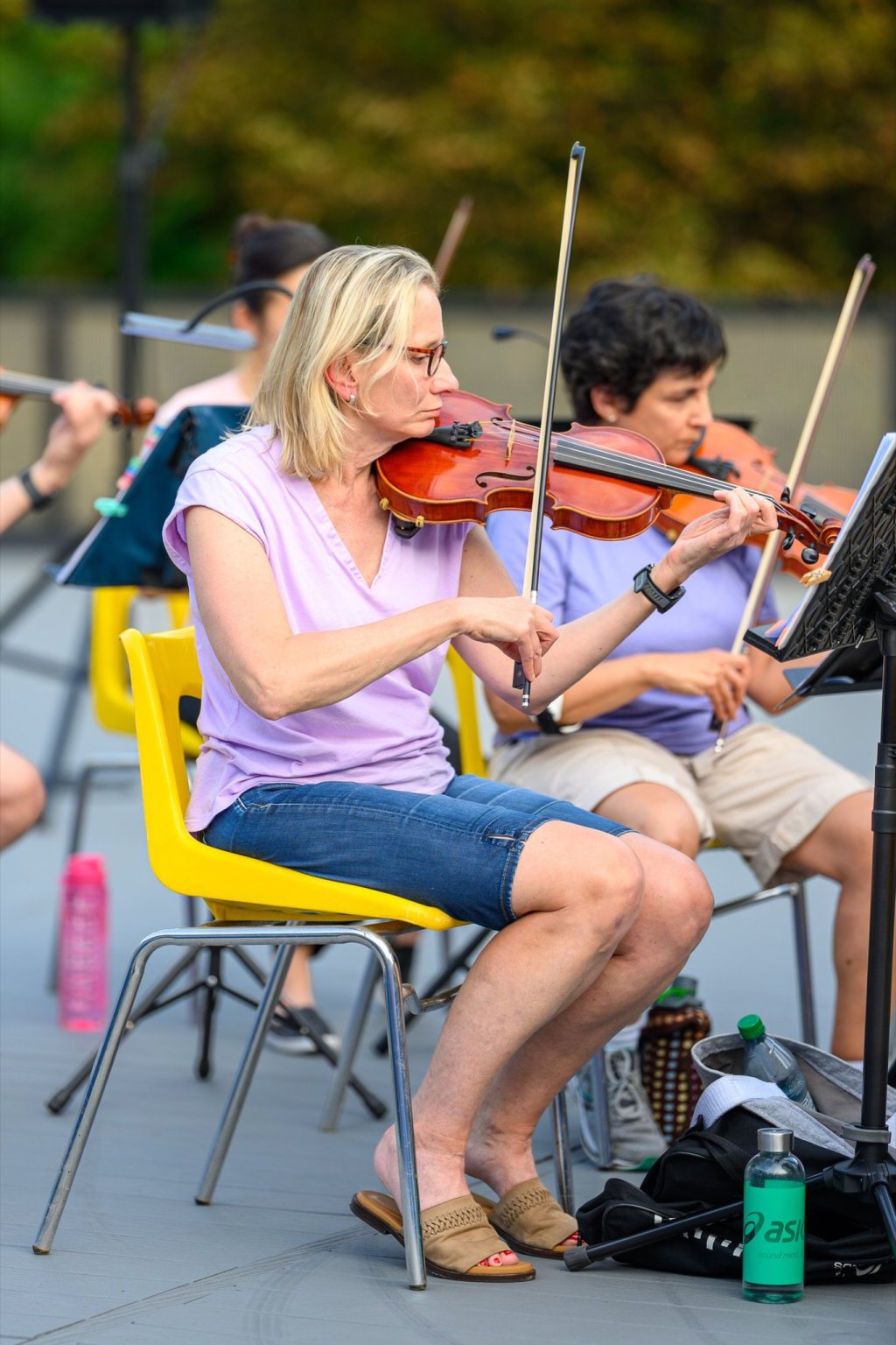 Violinists performing outdoors at Earl Bales Park