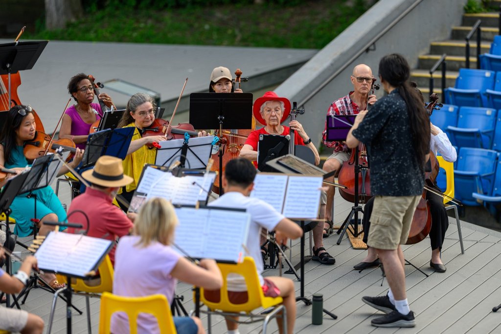 Musicians of all ages playing together at Earl Bales Park