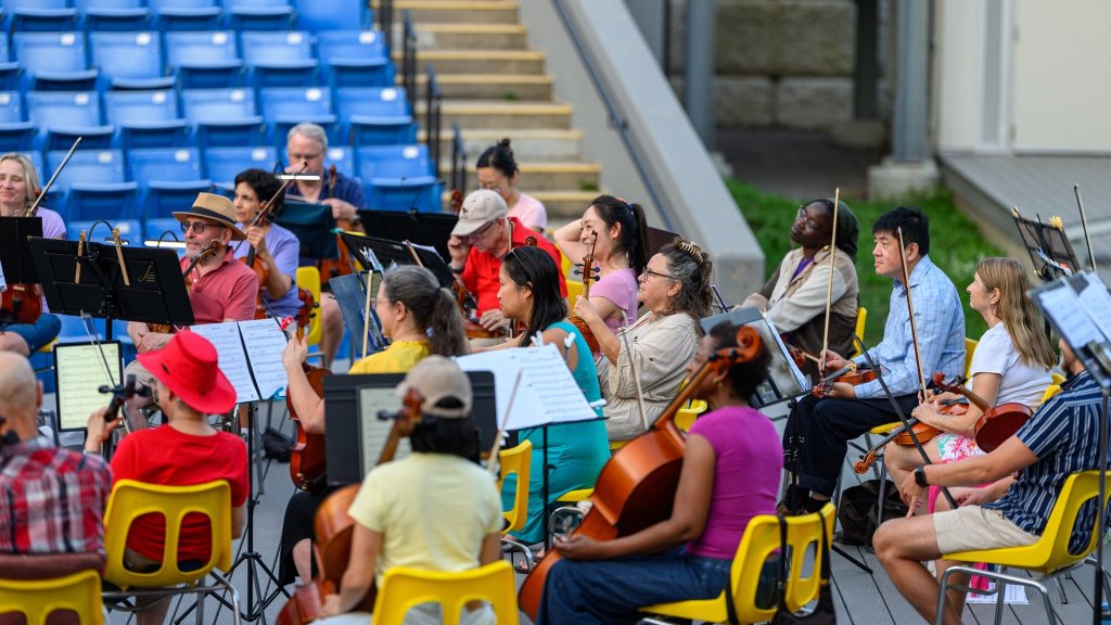 Players and audience at the Earl Bales Park amphitheatre