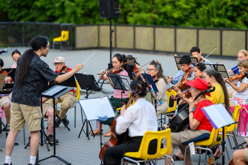 The conductor and players at Earl Bales Park
