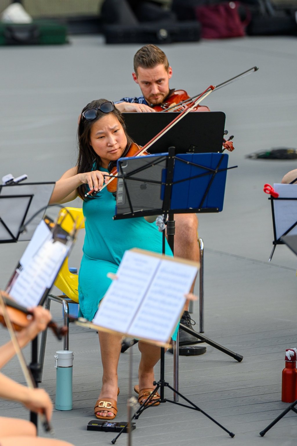 A young violinist playing on the amphitheatre stage at Earl Bales Park
